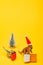 Toy dinosaurs in santa hat with shopping bags and christmas tree