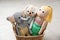Toy elephant, dog and doll in basket on floor. Decor for children`s room interior