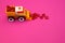 Toy excavator raking hearts. Pink background. Children`s love game