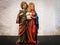 Toy figure of baby Jesus held by father Joseph and virgin mother Mary
