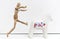 Toy figure of man gestalt jumps on a statuette horse