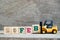 Toy forklift hold block B to word 29feb on wood background Concept for calendar date 29 in month February, leap day