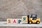 Toy forklift hold block R to word 2apr on wood background Concept for calendar date 2 in month april