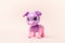 Toy friend for the kid. Toy plastic purple dog robot on a pink background