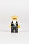 Toy hero Master Wu in a black kimono and a straw hat from a set of Lego ninjago on a white background. close-up.