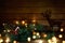 Toy house with Christmas tree, luminous garland on Christmas Eve