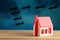 Toy house and formidable silhouettes of military aircraft