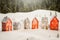 Toy houses creating a winter play scene in a white snowy field - a whimsical world of imagination