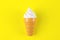 Toy ice cream on yellow background. Concept of harmful artificial food. Fast food