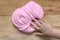 Toy for kids slime children`s hand kneads the mass of pink