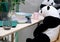 toy Panda sits at the table.
