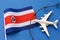 Toy plane, flag and barbed wire on colored background, Costa Rica air border violation concept