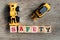 Toy plastic bulldozer hold toy block letter s to word safety