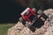 Toy rc suv overcoming rock track