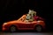 Toy red car squirrel family