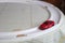 Toy red sport car on a breadboard. racing car on race ring track on the table at home. children`s games at home. Racing car on th