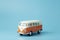 Toy retro bus Volkswagen on a colored background. Hippie retro bus