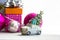 Toy retro car, green Christmas tree on a roof and pink gift box. New Year 2022.