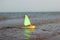 Toy sailboat sailing on the water. Children\\\'s toy. Summer, daytime. Selective Focus