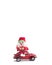 Toy Santa sitting on the roof of red retro car Volkswagen Beetle on white