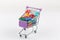 Toy shopping cart filled with letters and numbers - back to scho