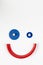 Toy smile face , cartoon smiley character, minimal geometric toy clown on white background. Top view