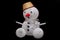 The toy snowman with the basket on the dark