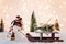 Toy snowman pulling small wooden sleigh