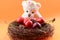 Toy teddy bear collecting Sweet cherries