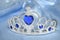 Toy tiara with diamonds and blue gem