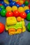 Toy train for kids with colored balls. Bright children's toys.