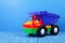 Toy truck dump truck on a blue background
