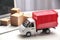 Toy truck near laptop. Logistics and wholesale concept