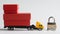 Toy truck with trailer loaded with boxes of goods stands next to prohibition sanction road sign and  padlock. White background. Ð¡