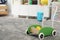 Toy walker on floor in child`s room, space for text. Interior design