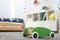 Toy walker on floor in child`s room, space for text. Interior design