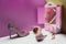 toy wardrobe with real size shiny high heels and handbag in miniature