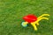 Toy wheelbarrow on the green grass