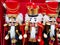 Toy wood soldiers dressed in Christmas costumes