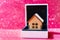 Toy Wooden House Model in a Gift Box on Pink