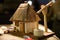 Toy wooden house. A model of traditional rural Ukrainian house with a well in which the Cossacks lived