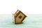 Toy wooden model house as symbol family and love concept on sunny