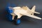 Toy wooden plane with rotating blue propeller