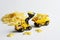 Toy yellow forklift truck with a bucket loads farfalle paste into the back of a heavy-duty dump truck. Concept of delivering food