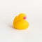 Toy yellow rubber duck isolated on white background. Opposition symbol and political struggle