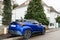 TOYOTA C-HR hybrid blue SUV in French city road