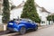 TOYOTA C-HR hybrid blue SUV in French city road