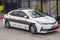 A Toyota Corolla car in Police Force with hi visibility livery parked outside a police station on the Mount of Olives in Jerusalem