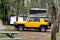 Toyota FJ cruiser car with rooftop pop up tent camping on a campsite. Travel vacation