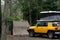 Toyota FJ cruiser car with rooftop pop up tent camping on a campsite. Travel vacation